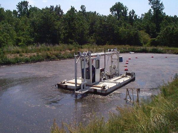 Sludge dredge working on a swine lagoon